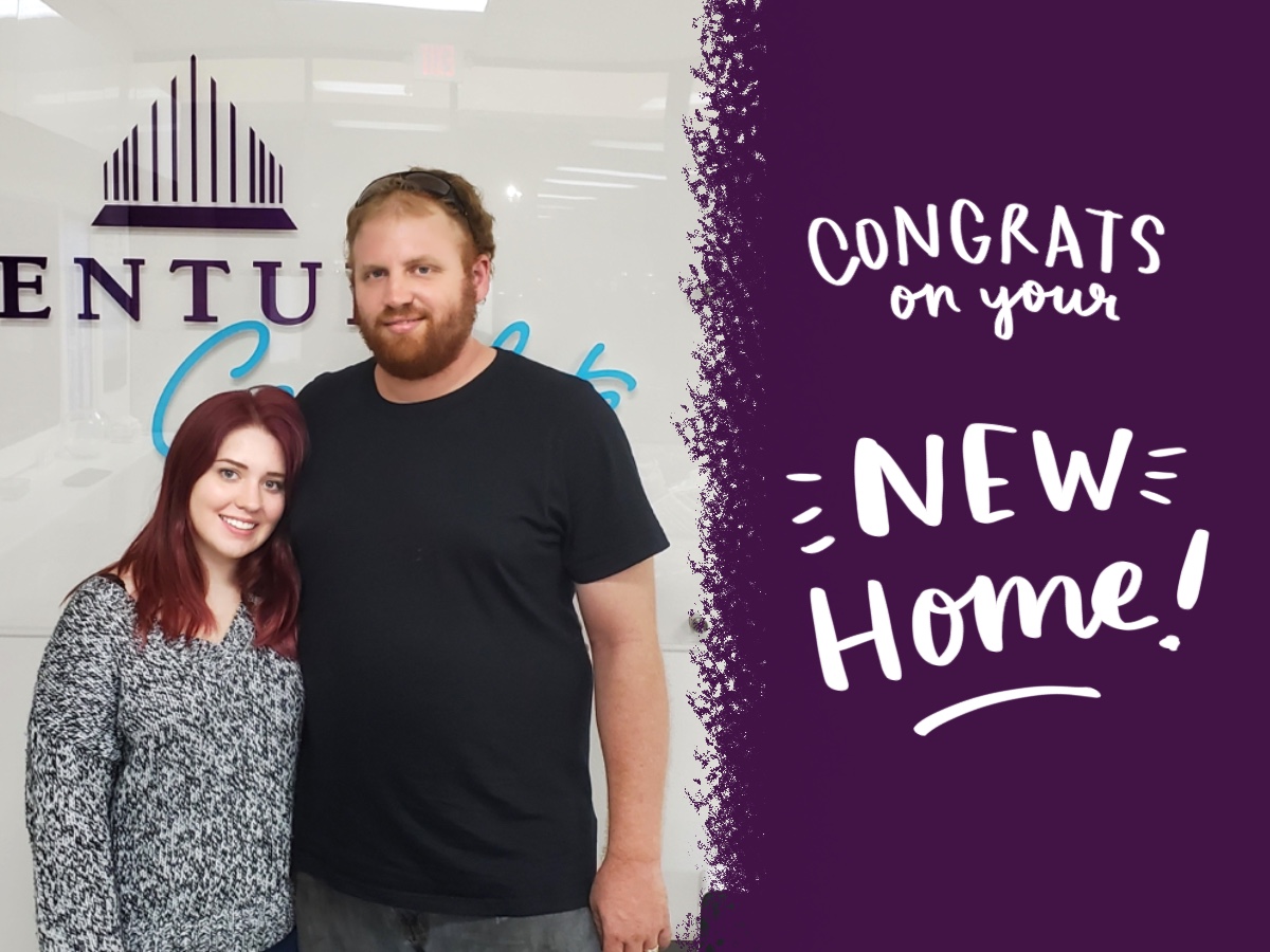 A man and woman posing for a picture.