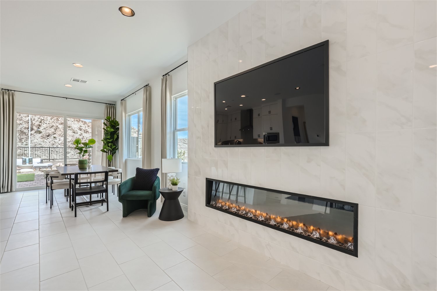 A room with a fireplace and a table.