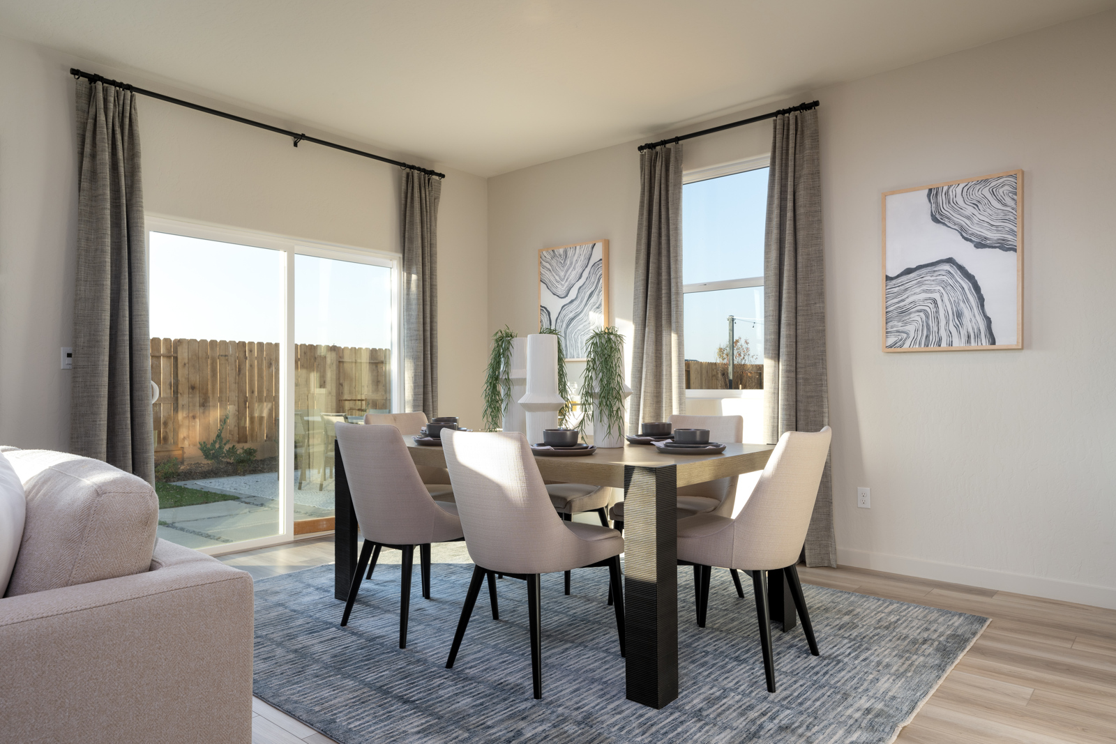A dining room table with chairs.