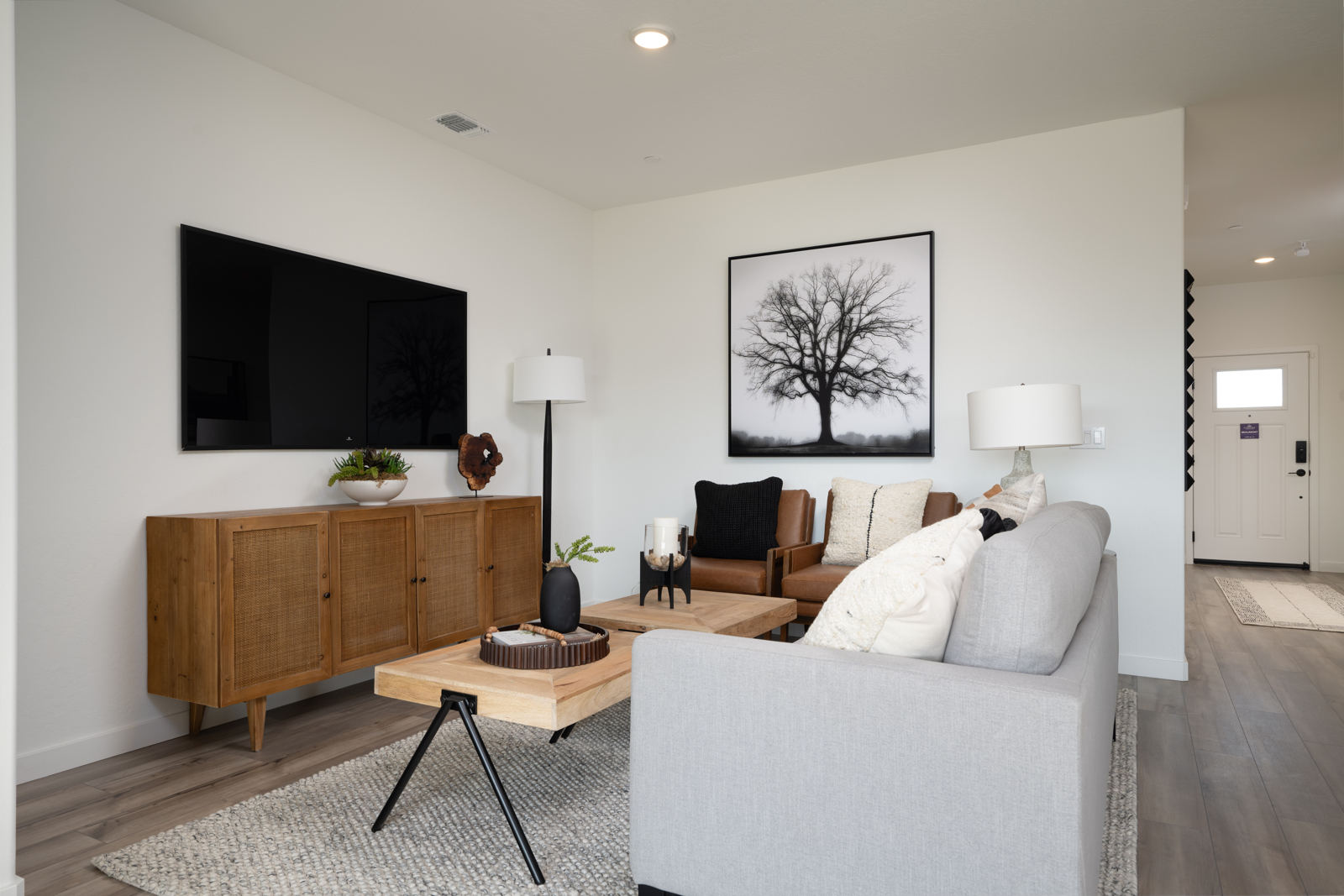 A living room with a tv and couches.