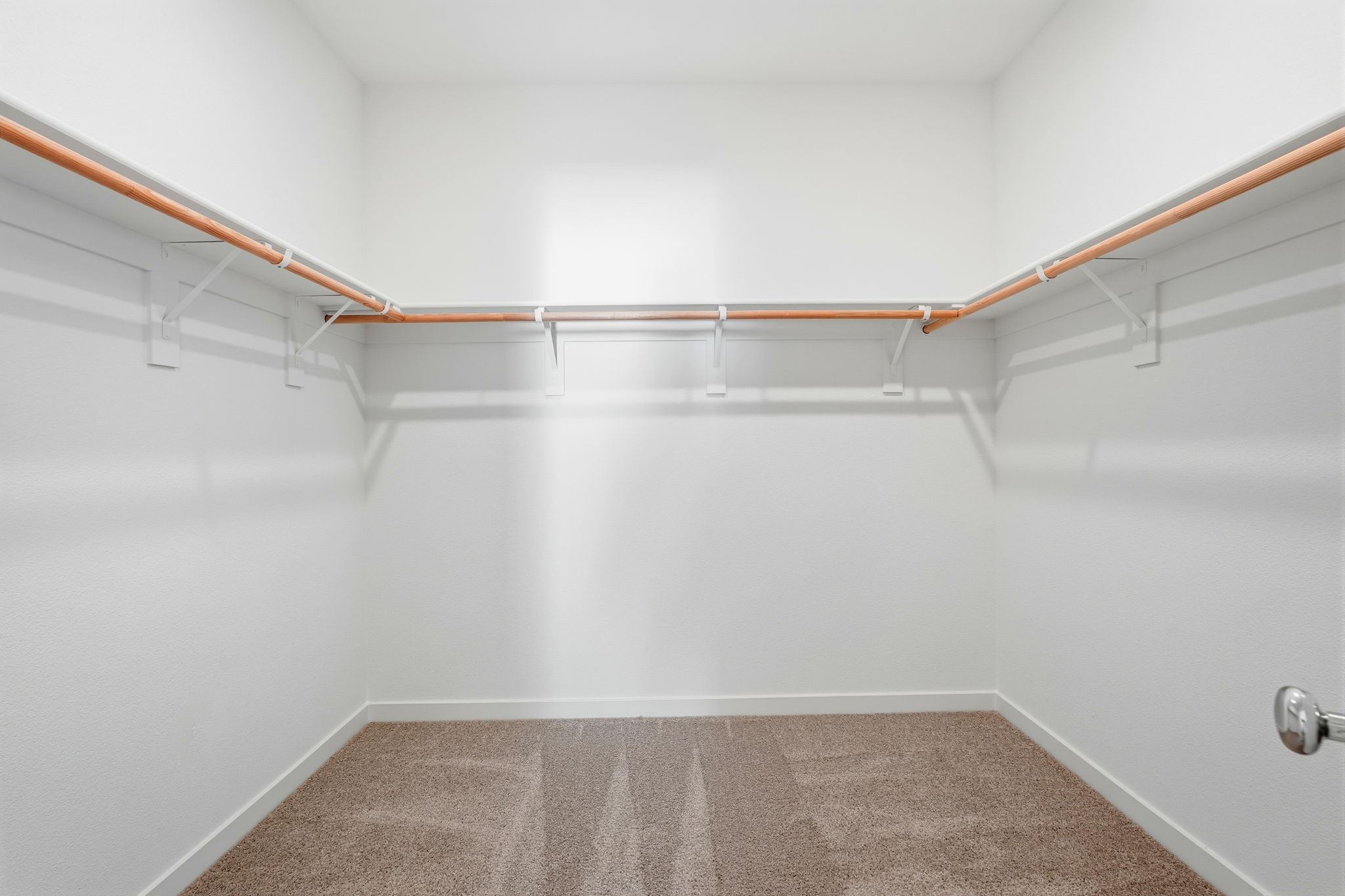 A white room with a staircase.