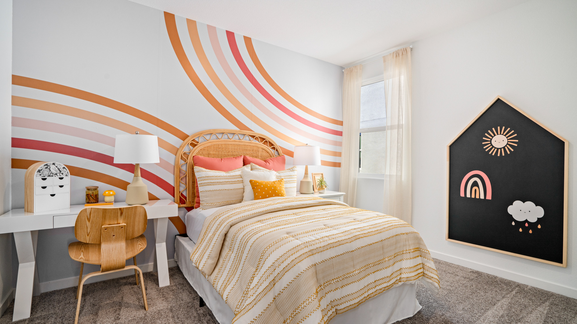 A bedroom with a bed and a desk.