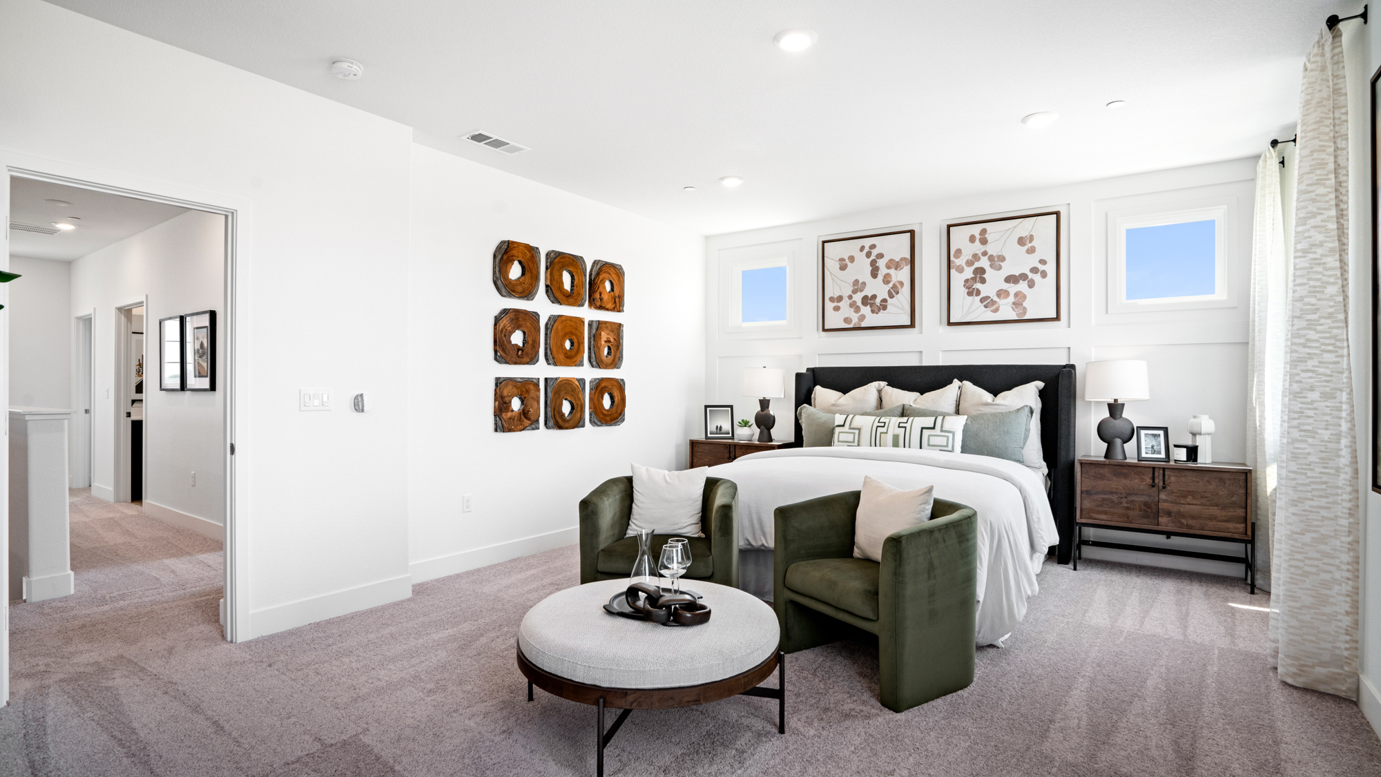 A bedroom with a bed and a coffee table.