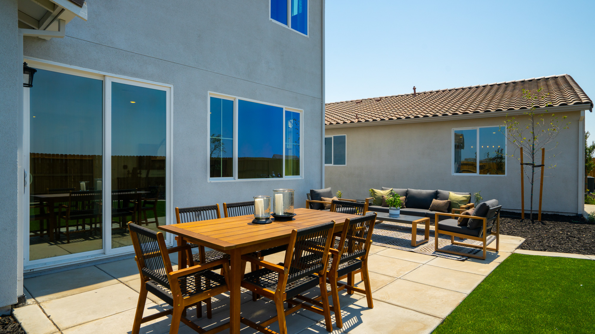A table and chairs on a deck.