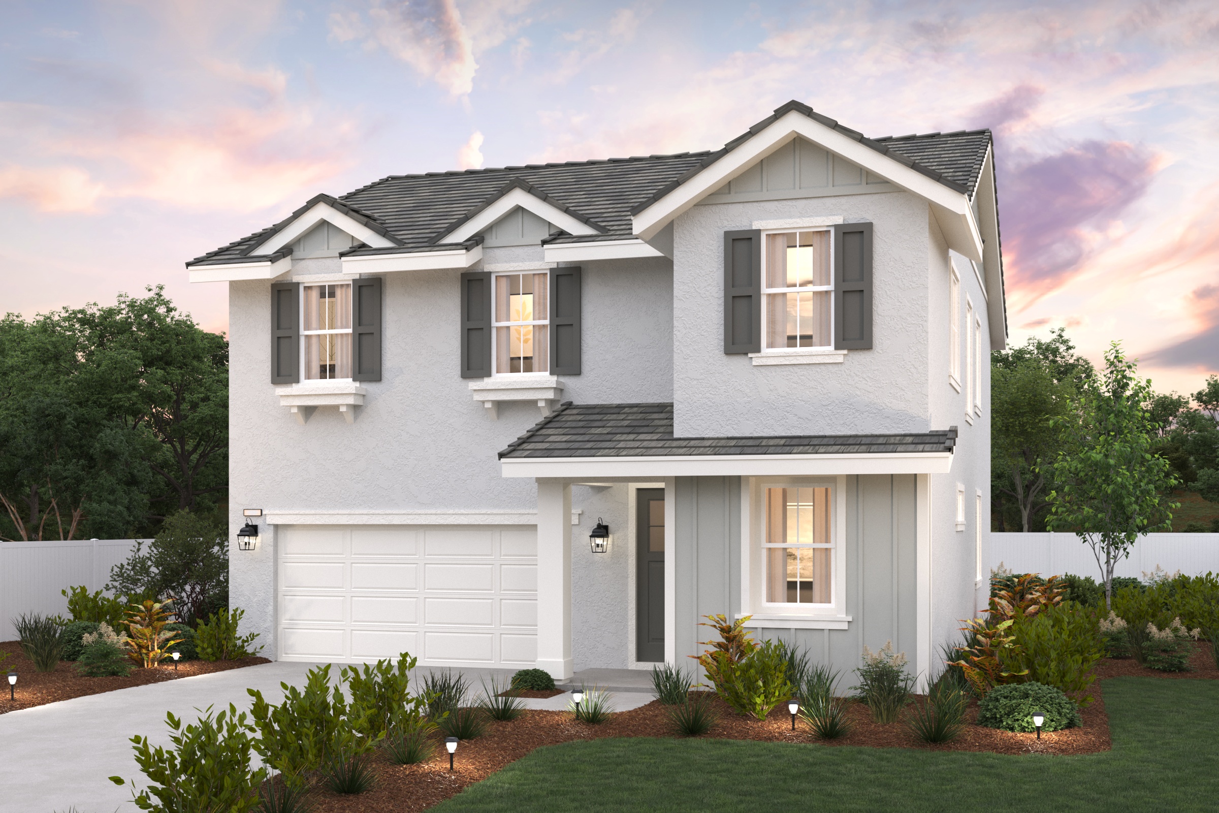 A white house with a garage with Graceland in the background.