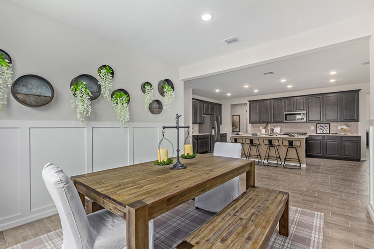 A kitchen with a dining table.