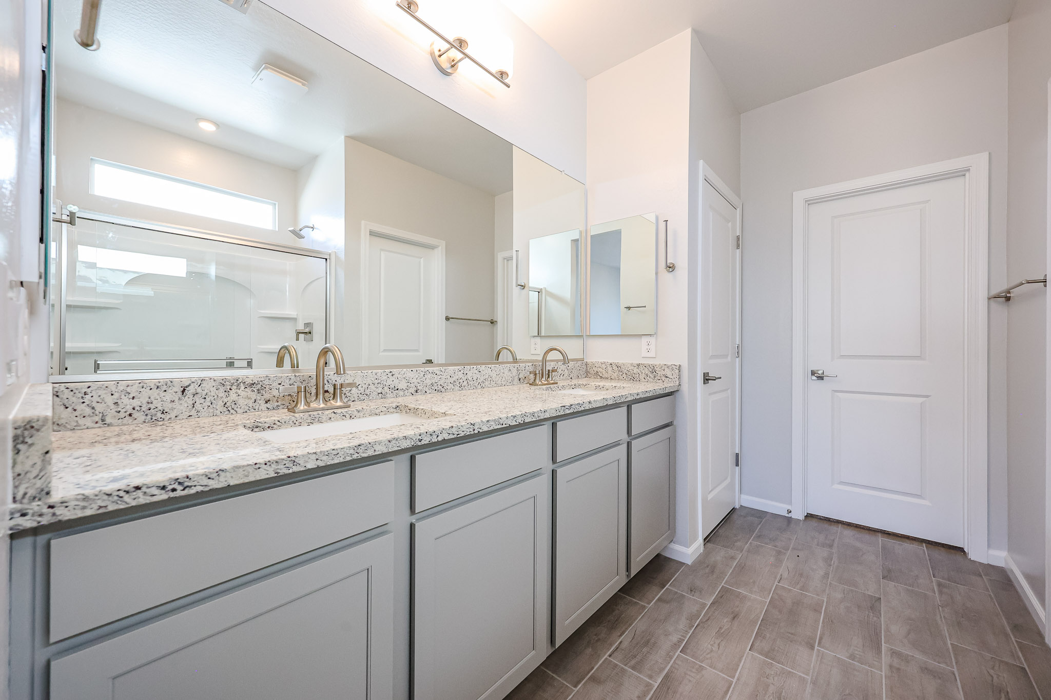 A bathroom with a marble countertop.