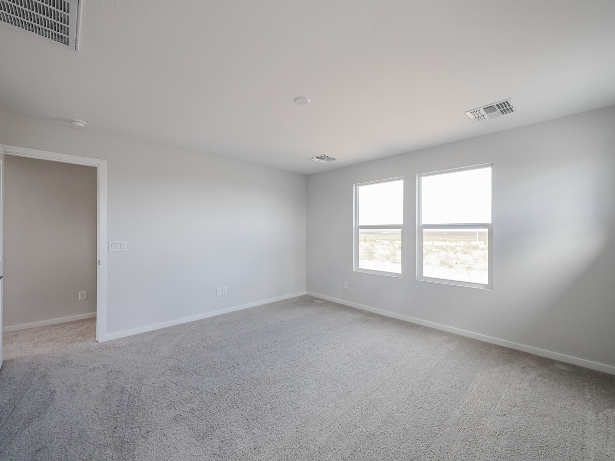 A room with a door and windows.