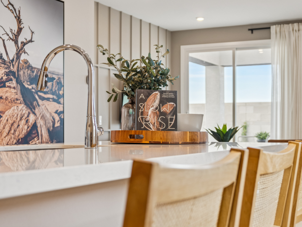 A dining room with a large mirror.