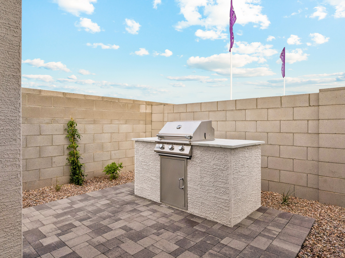 A concrete wall with a door and a flag on it.