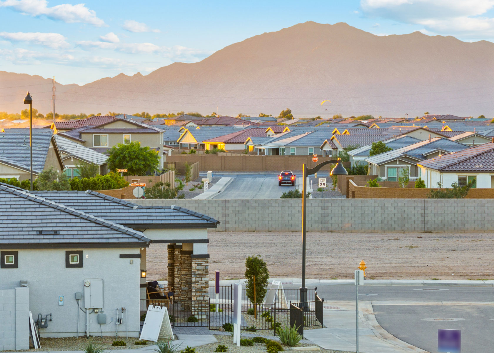 A town with a hill in the background.
