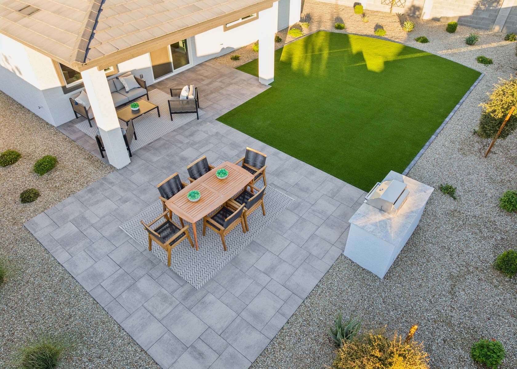 A patio with a table and chairs.