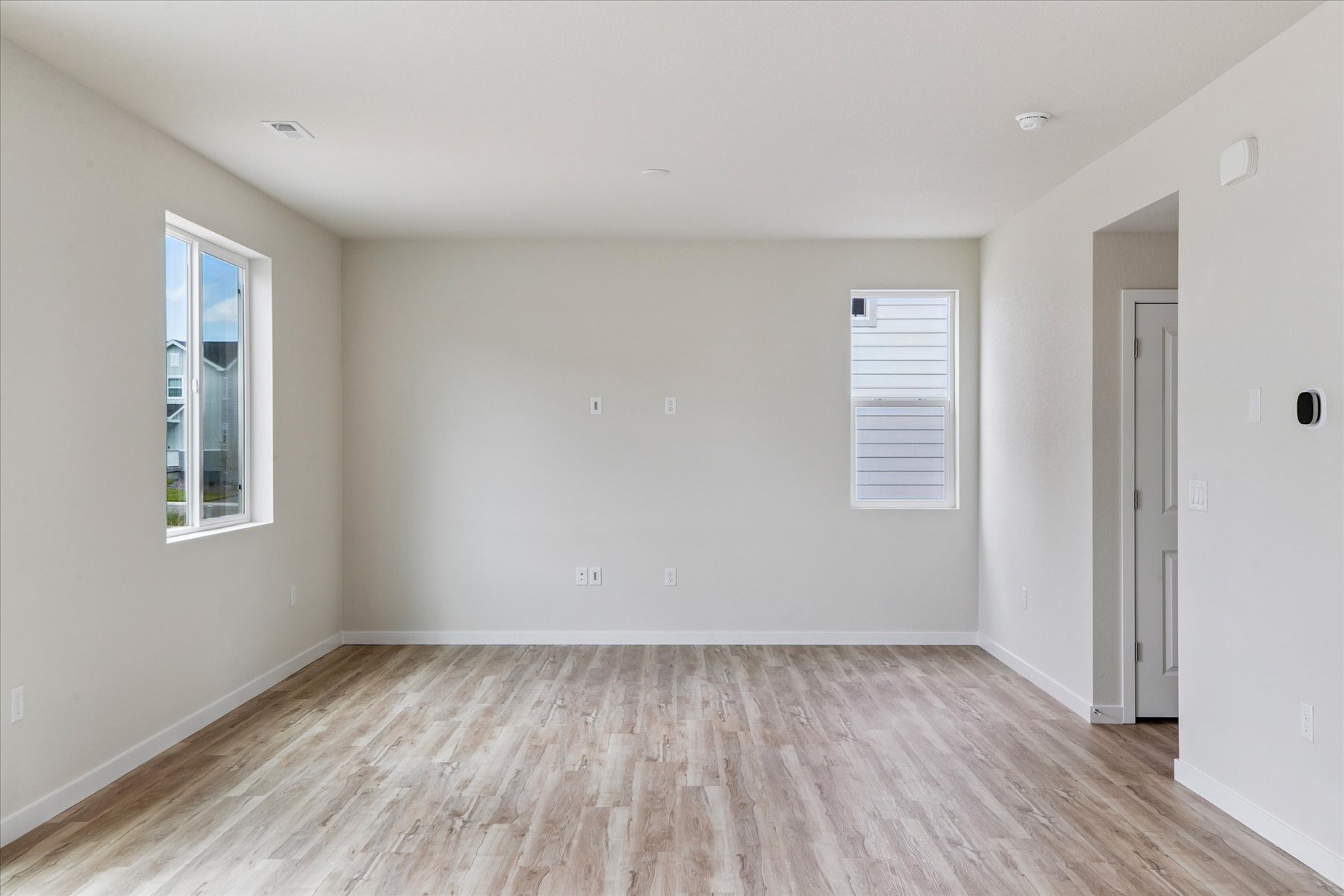 A room with a wood floor and a wood floor.