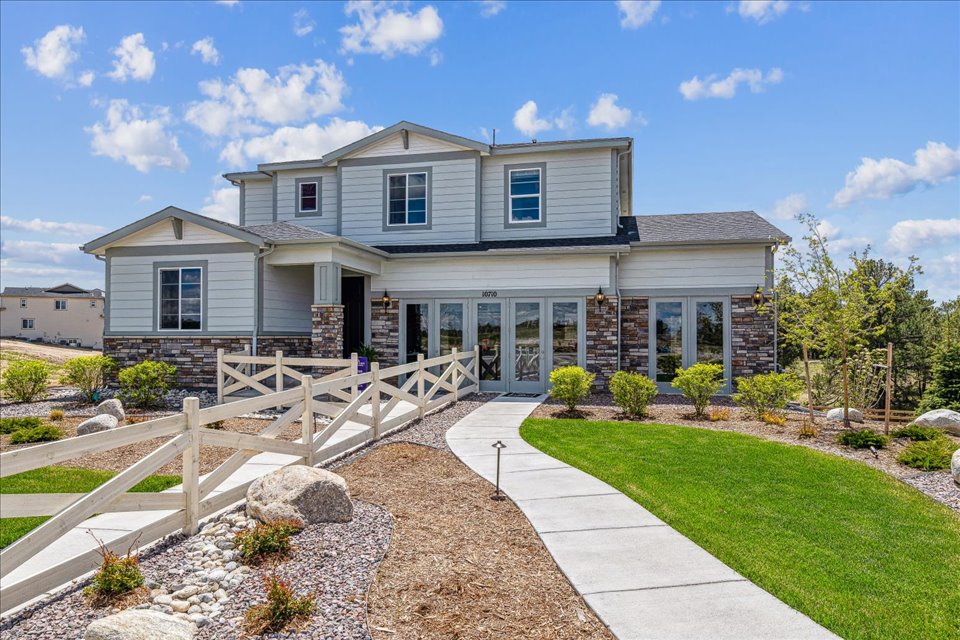 A house with a stone driveway.