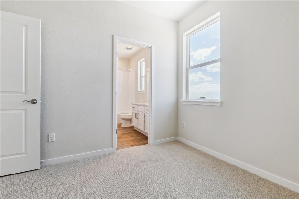 A room with a door and a window.