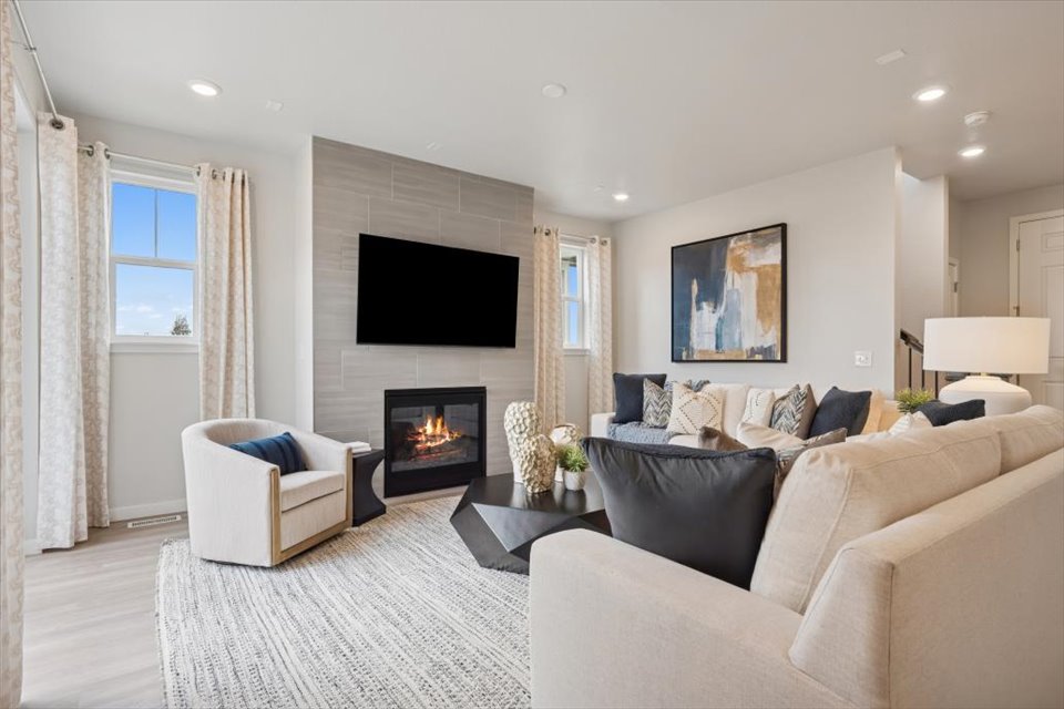 A living room with a fireplace.