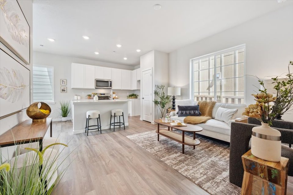 A living room with a wood floor.