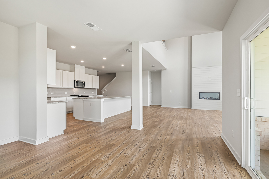 A large kitchen with white cabinets.