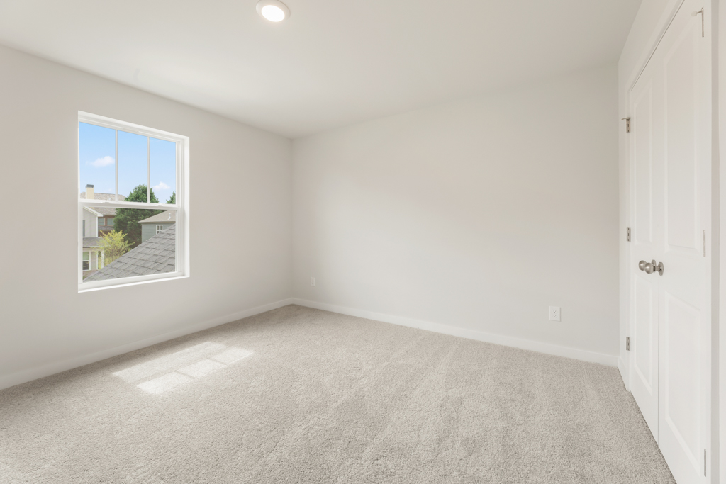 A room with a window and a door.