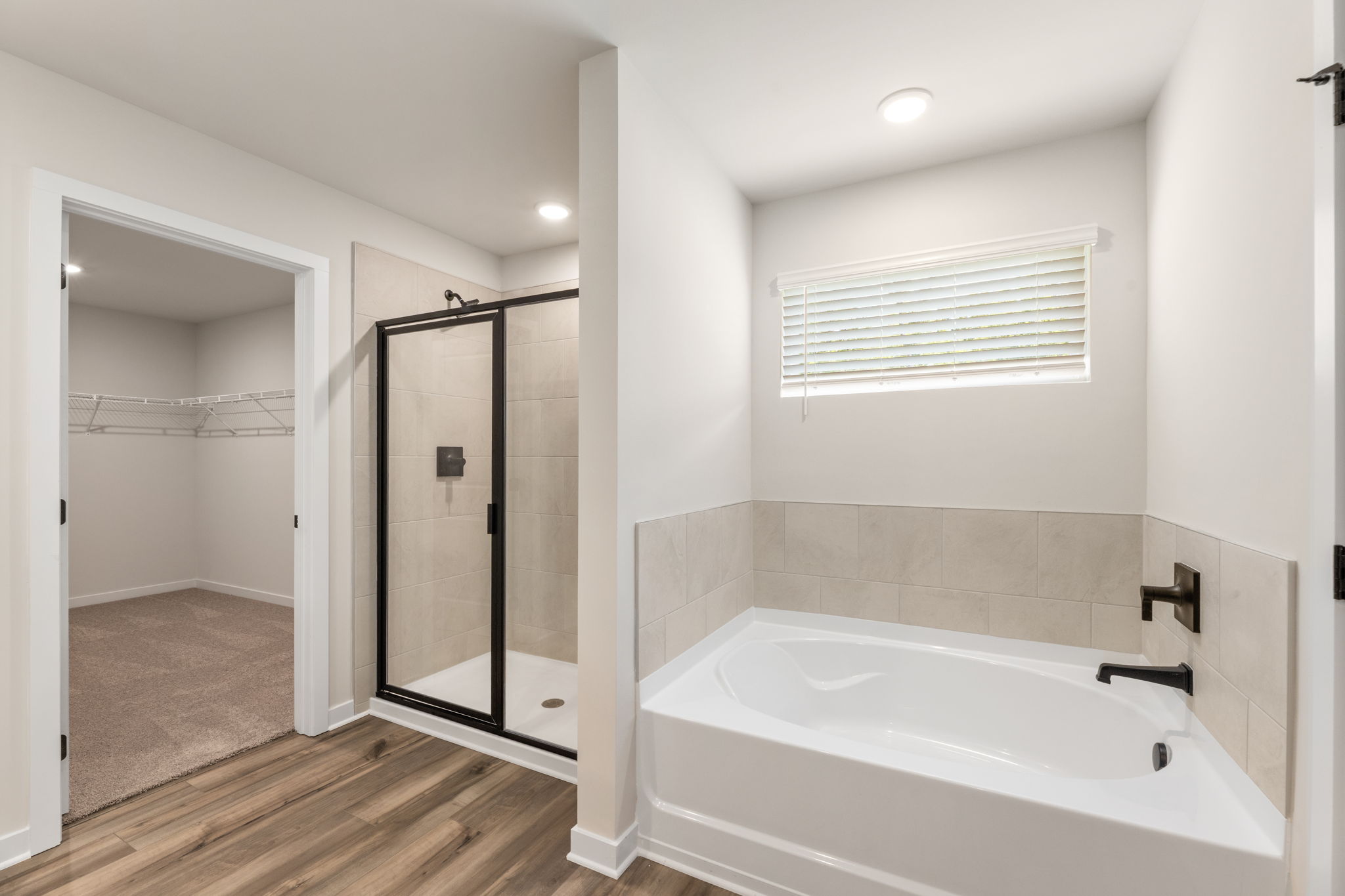 A bathroom with a tub and shower.