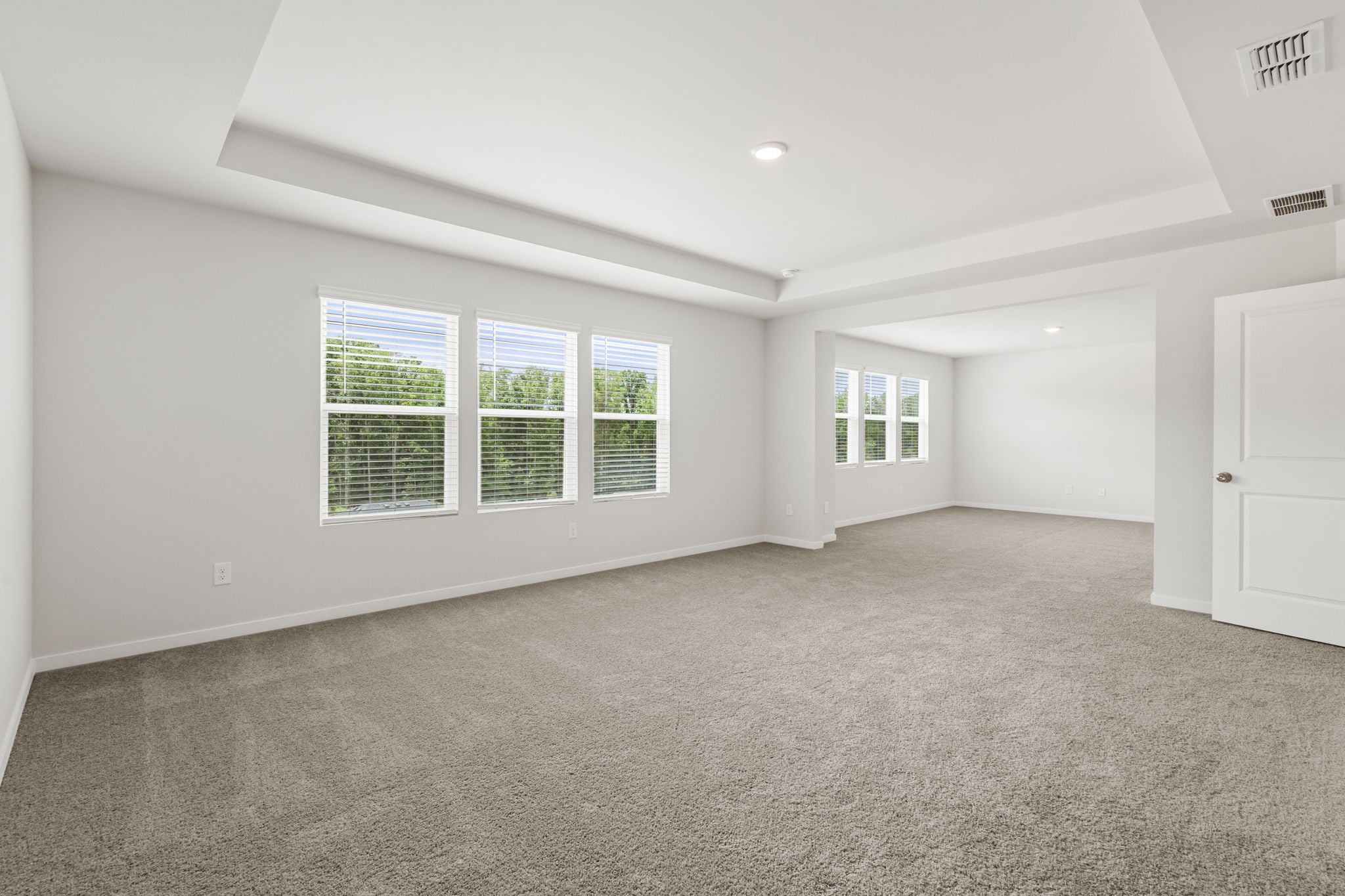 A room with white walls and windows.
