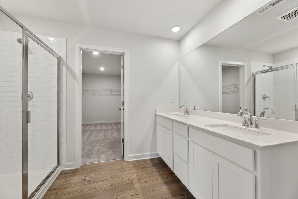 A bathroom with a glass shower.
