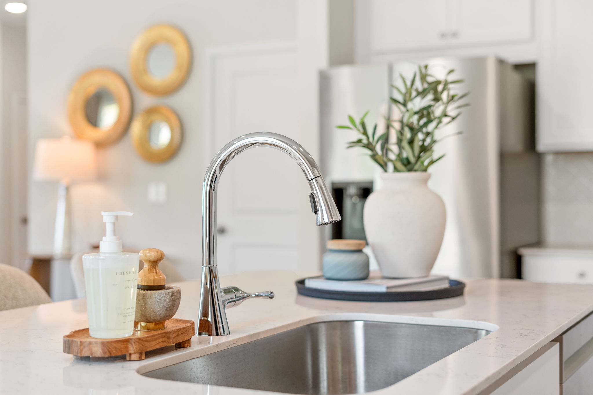 A sink with a plant on it.