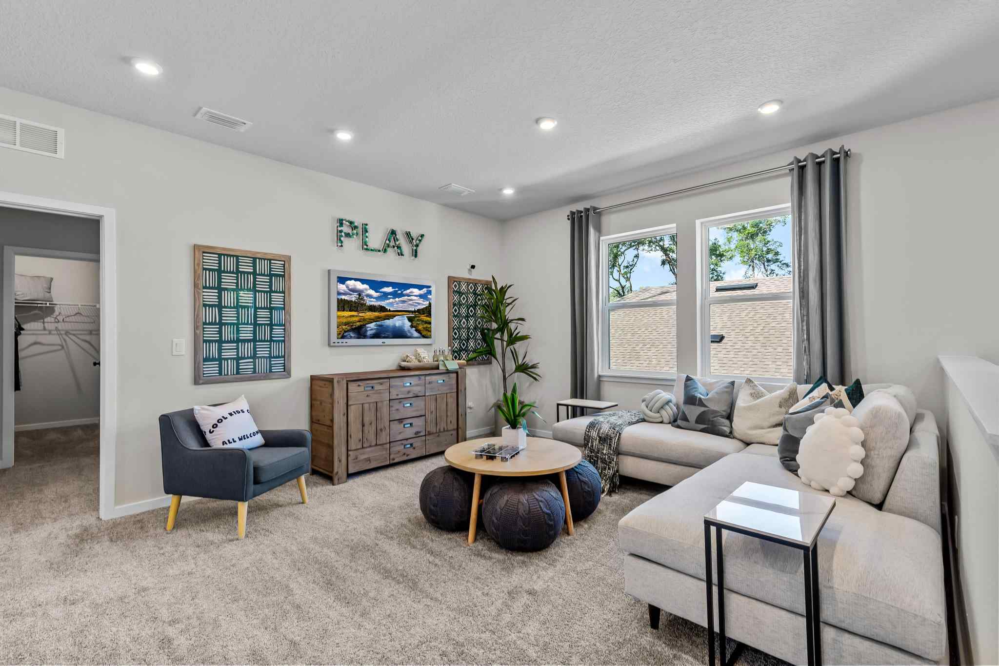 A living room with a couch and a table.