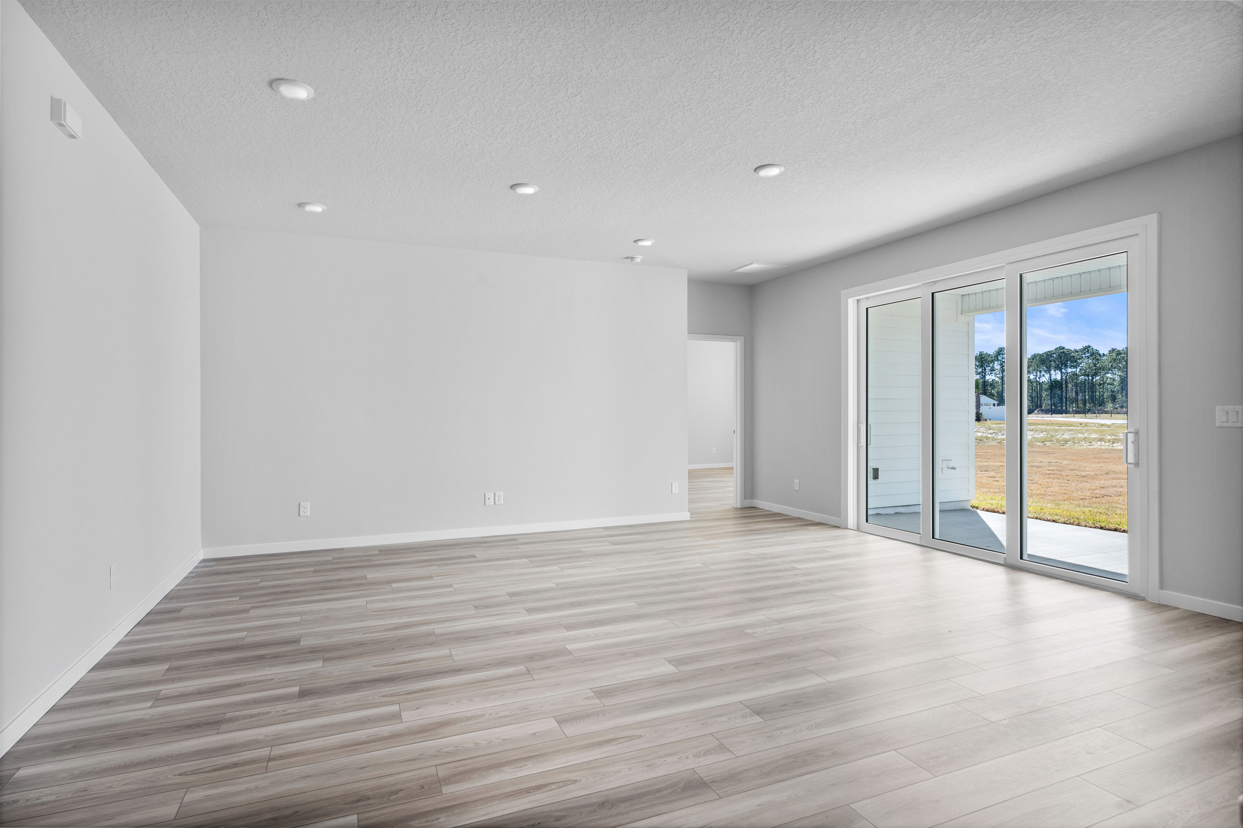 Lot 199 Living Area with Sliding Doors to Covered Patio at Reserve East