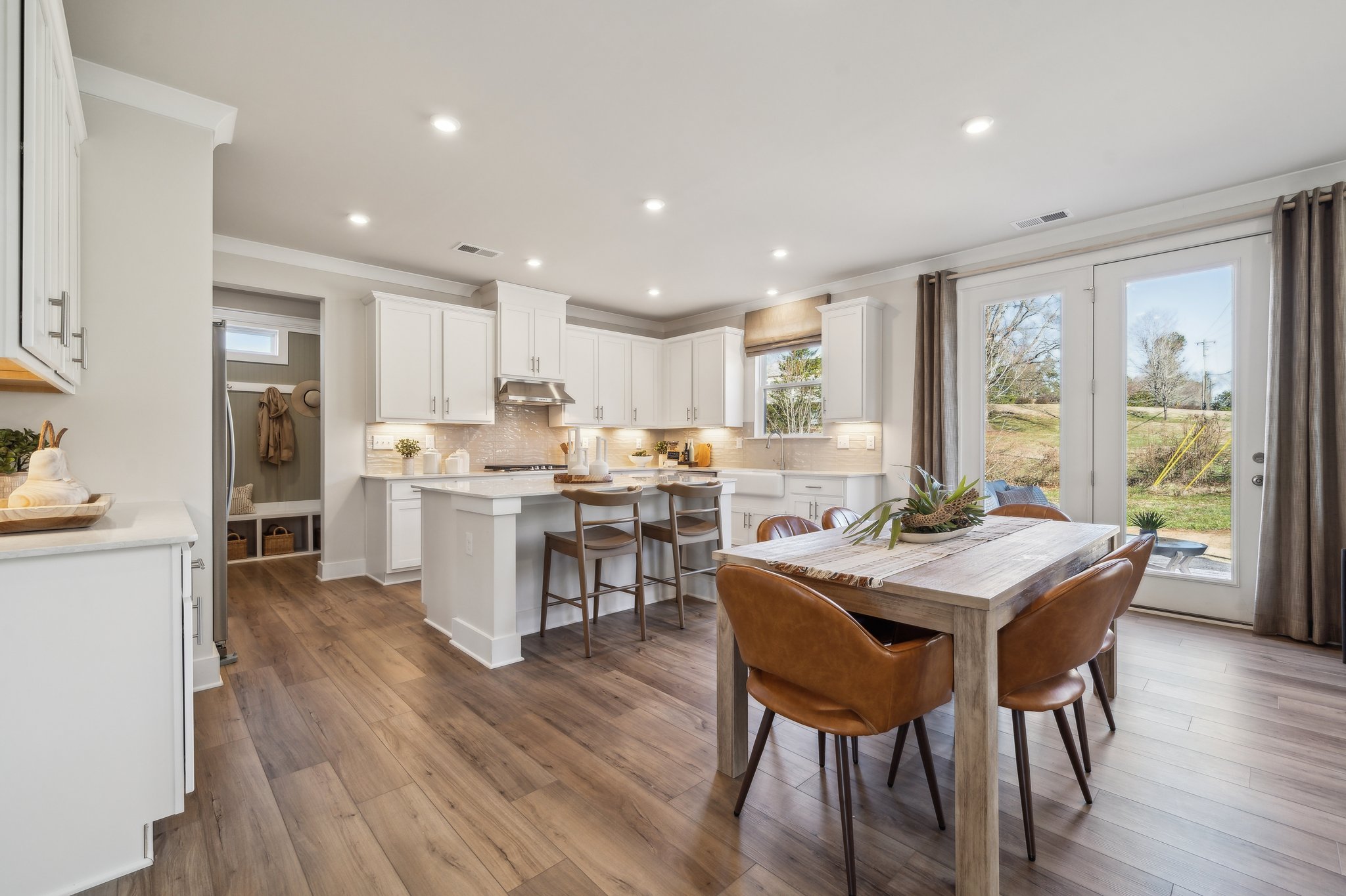 A kitchen with a dining table.