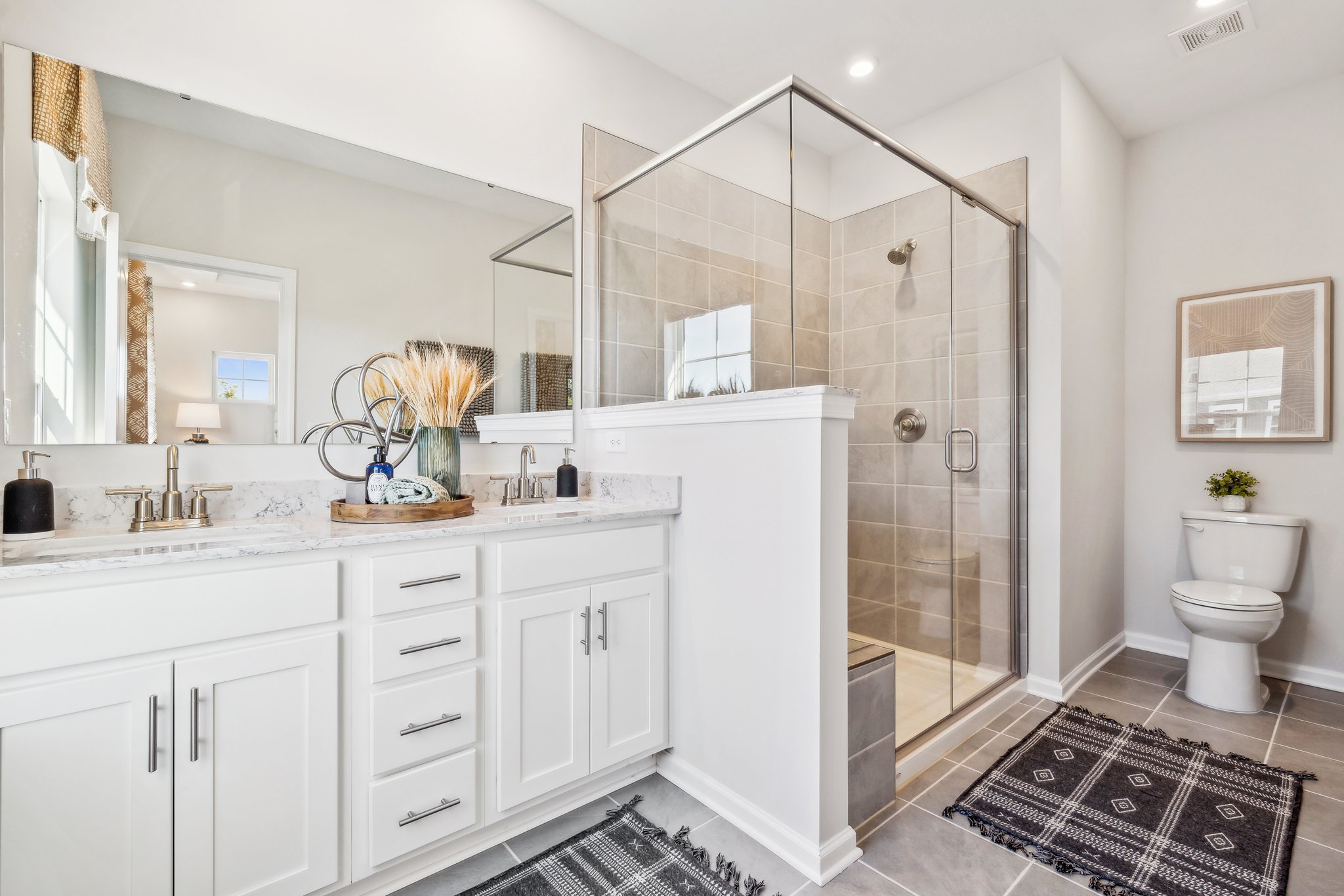 A bathroom with a glass shower.