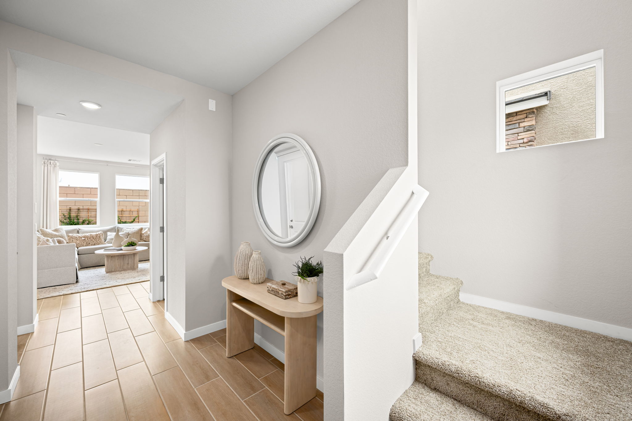 A room with a table and a mirror.