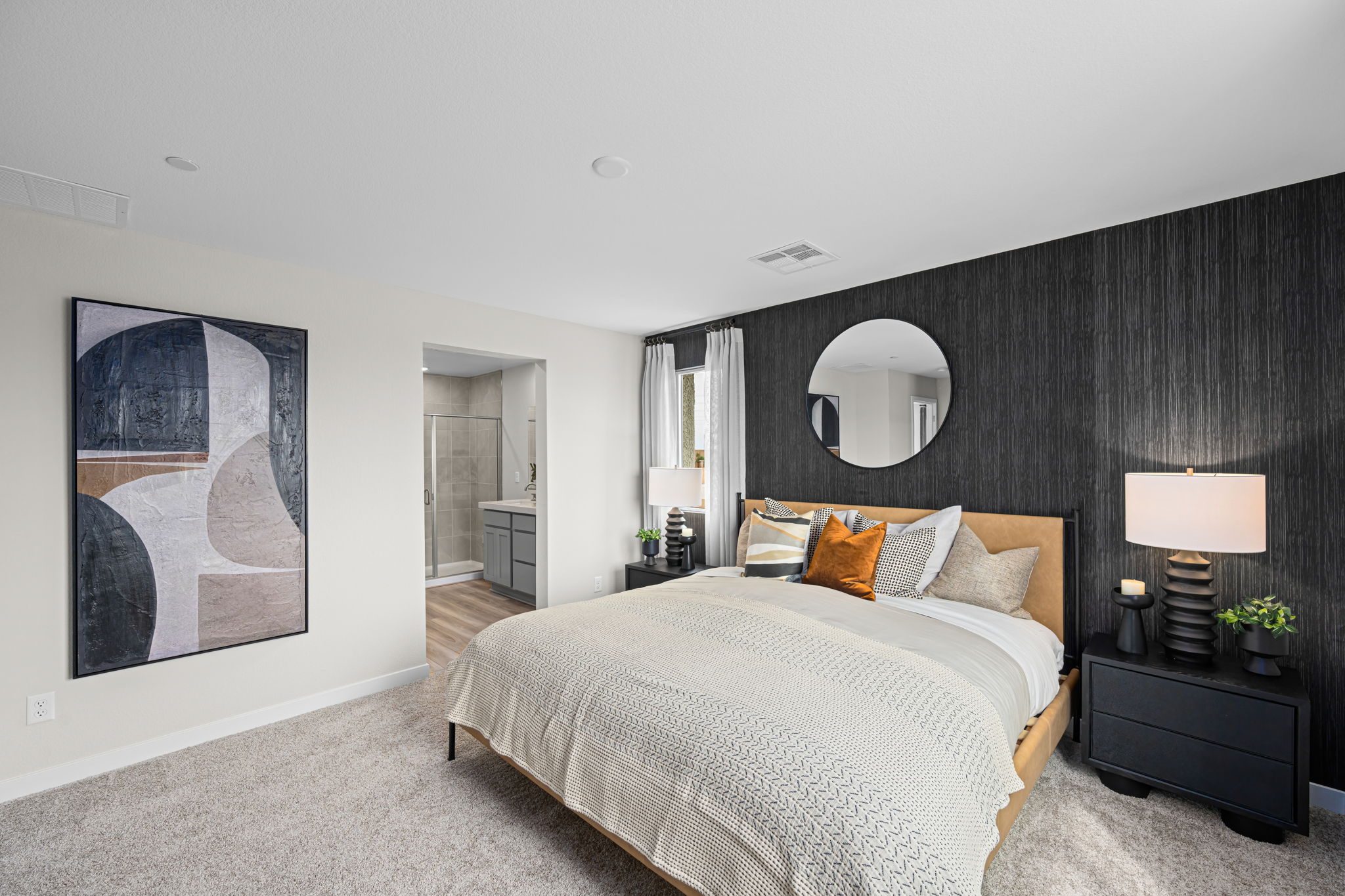 A bedroom with a large bed.