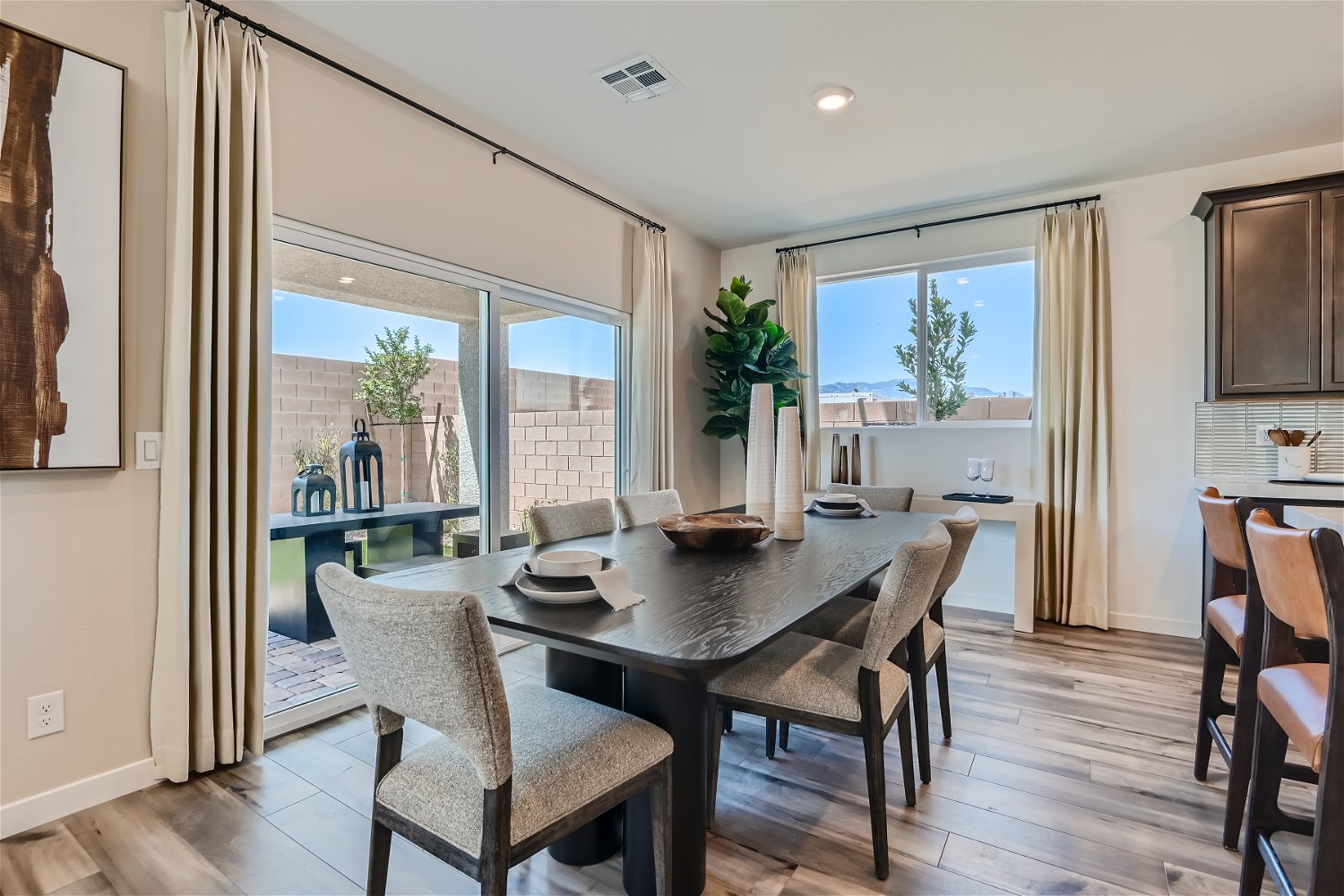 A dining room table with chairs.