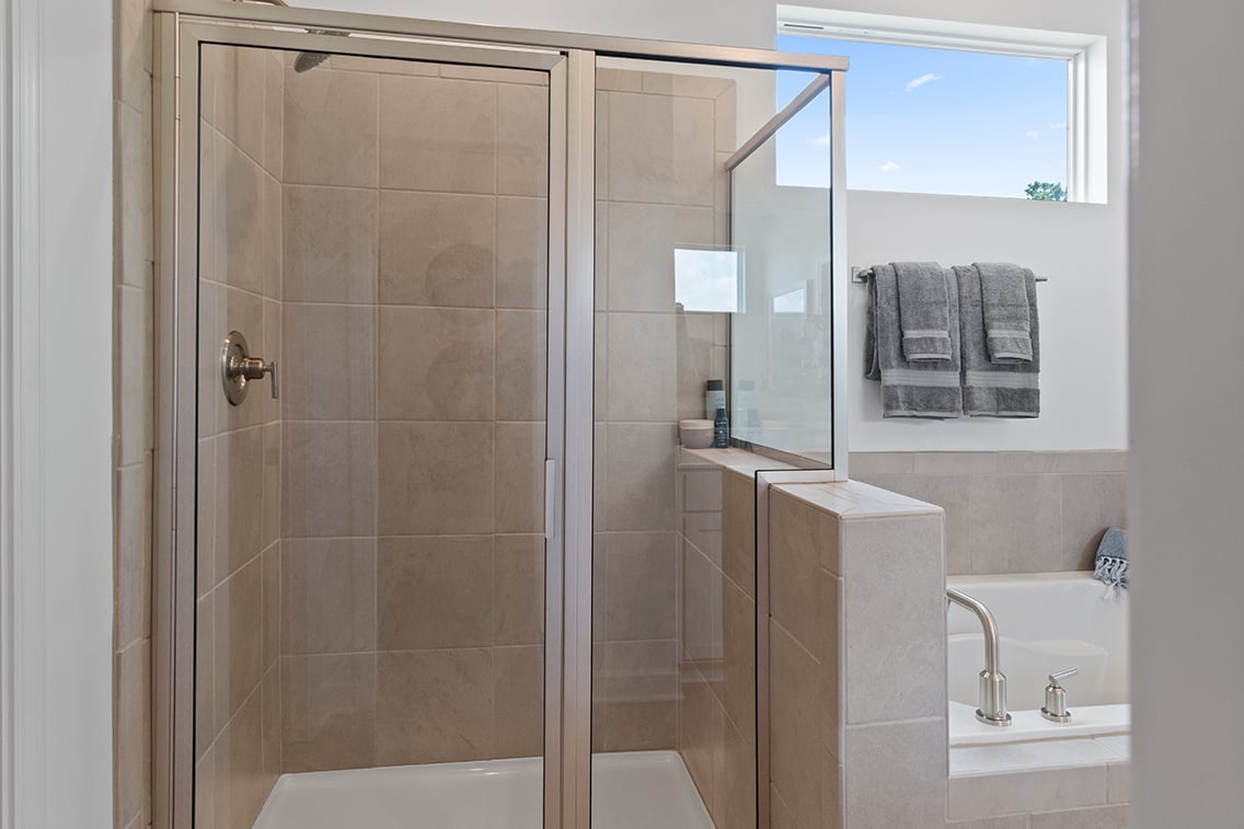 A bathroom with a glass shower.