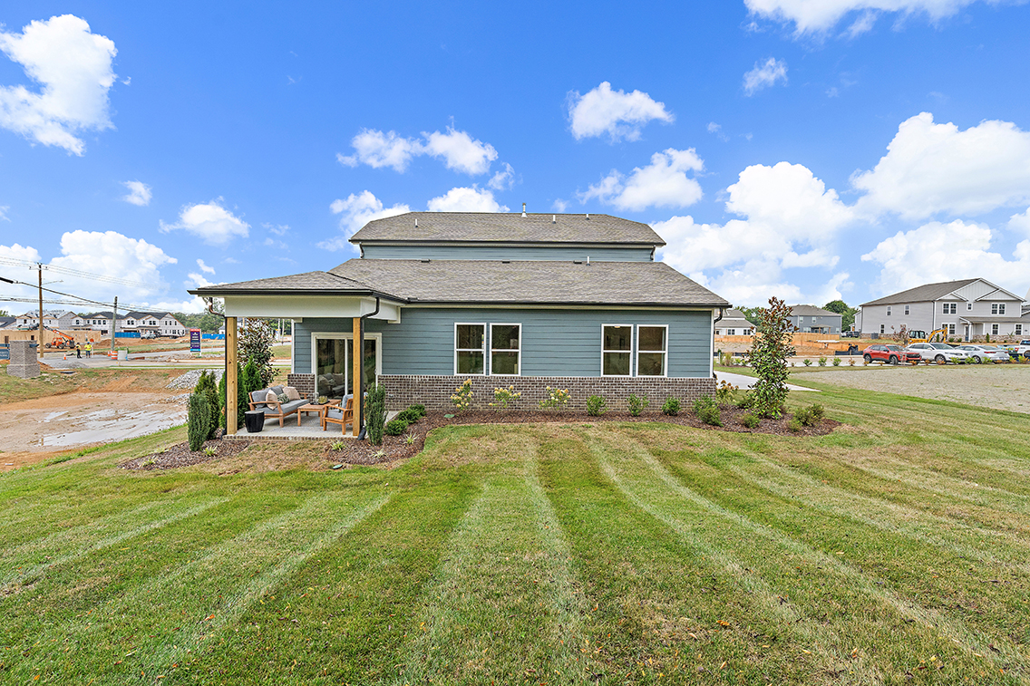 A house with a grass yard.