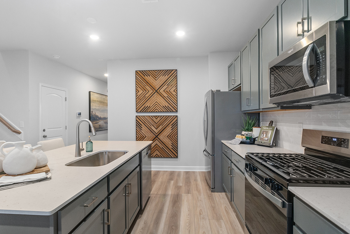 A kitchen with stainless steel appliances.