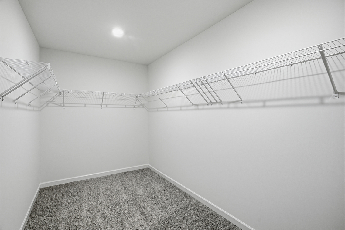 A white room with a staircase.