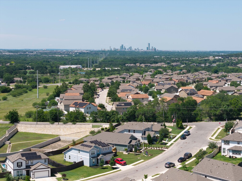 A city with many buildings and trees.