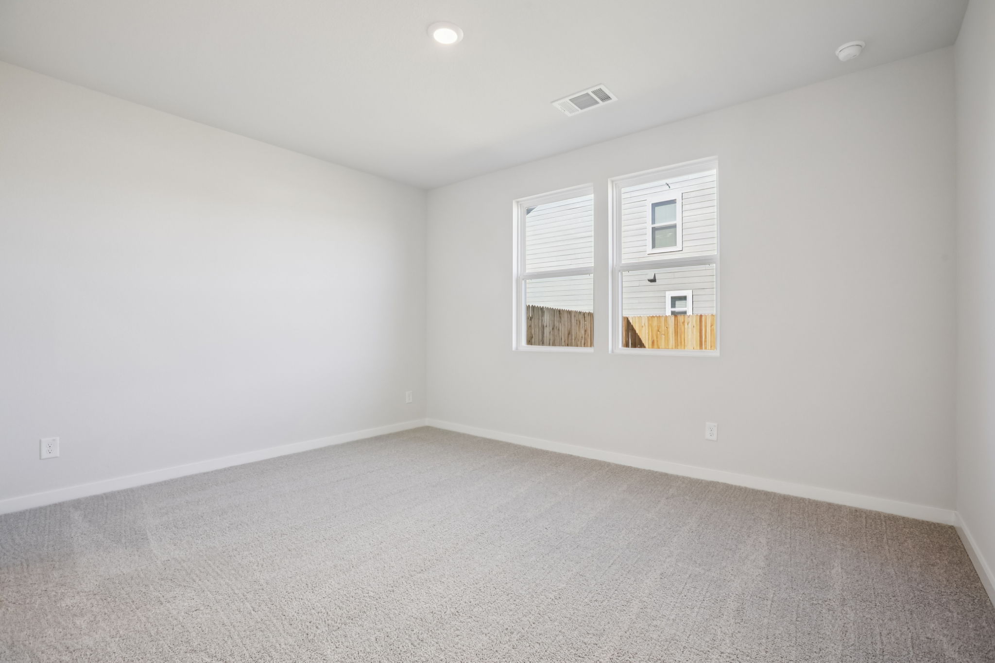 A room with a window and a door.