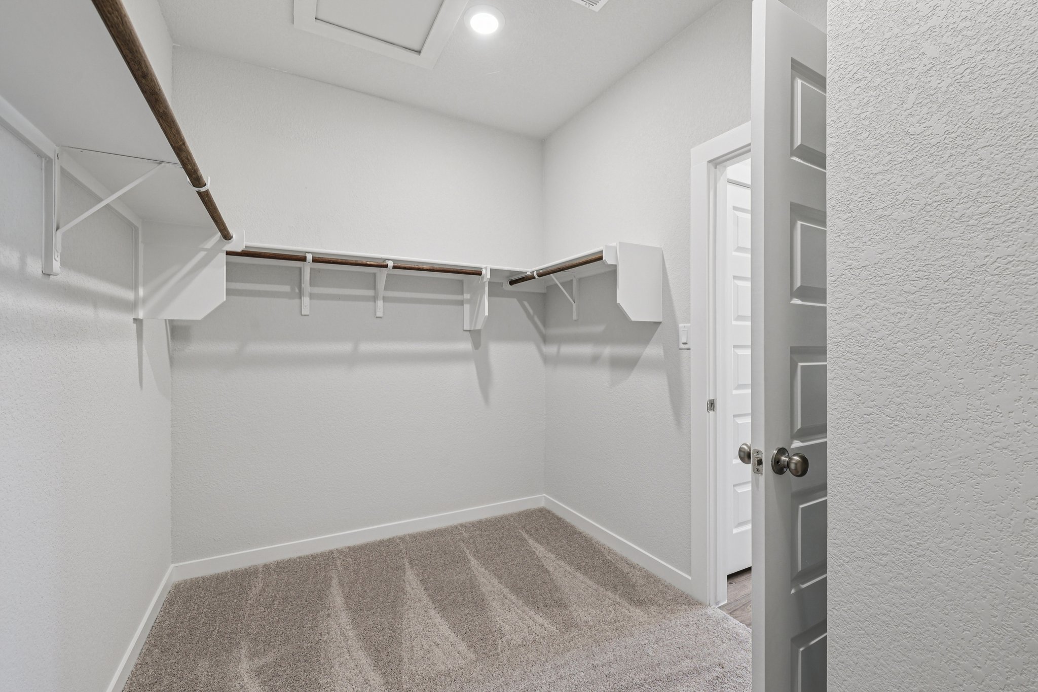 A bathroom with white walls.