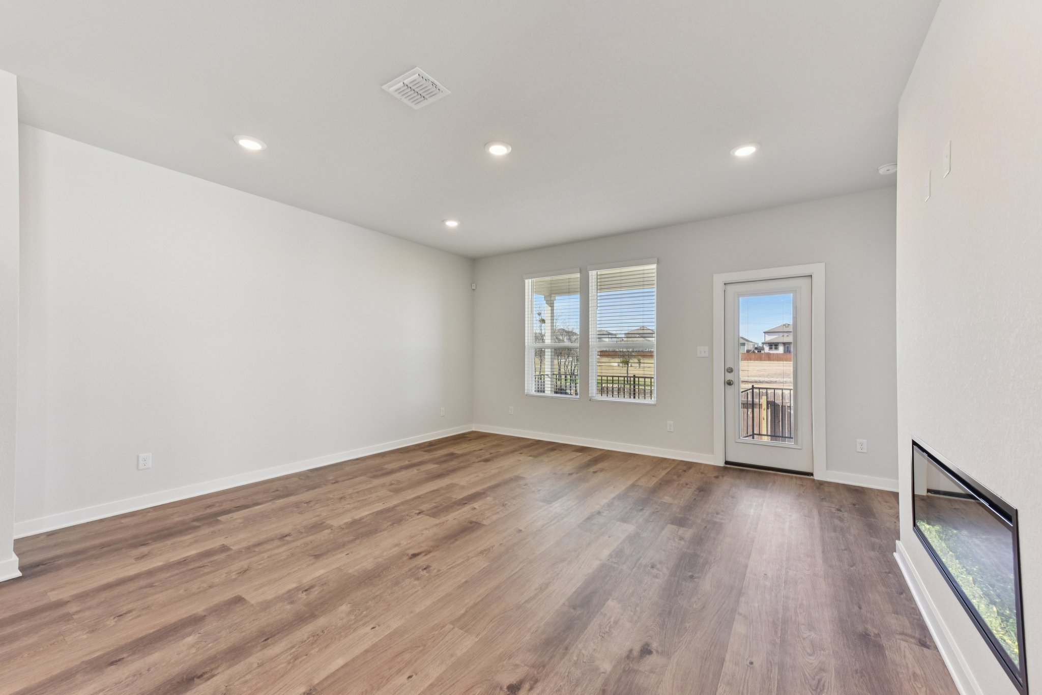 A room with a wood floor and a wood floor.