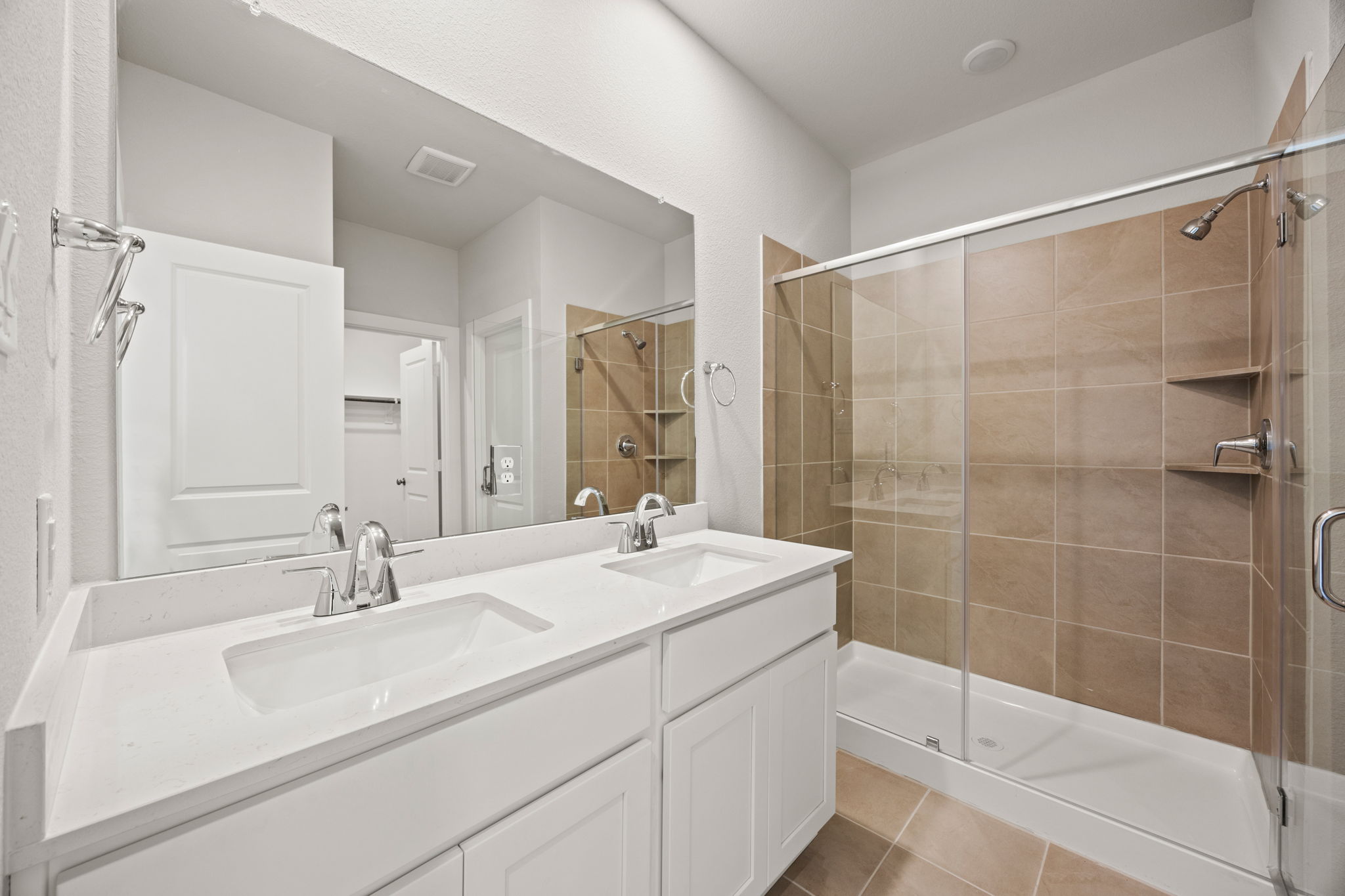 A bathroom with a glass shower.