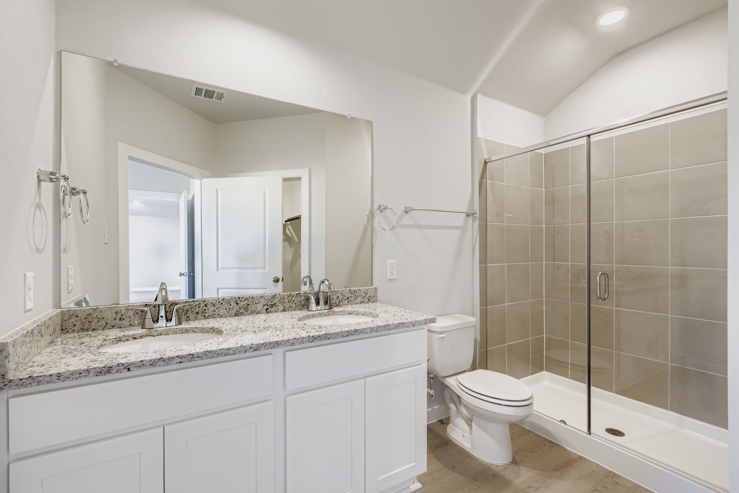 A bathroom with a marble countertop.