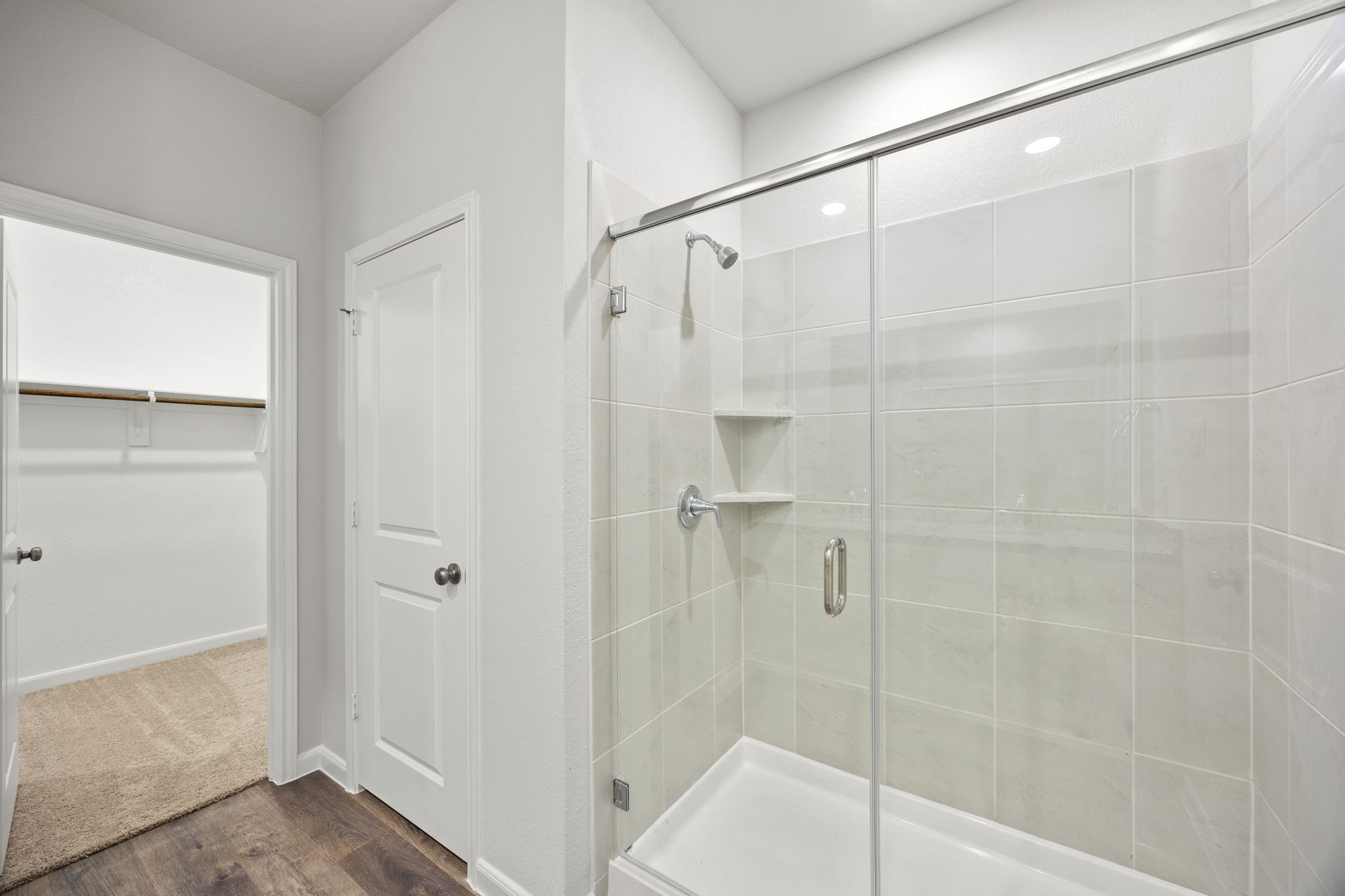 A bathroom with a glass shower.
