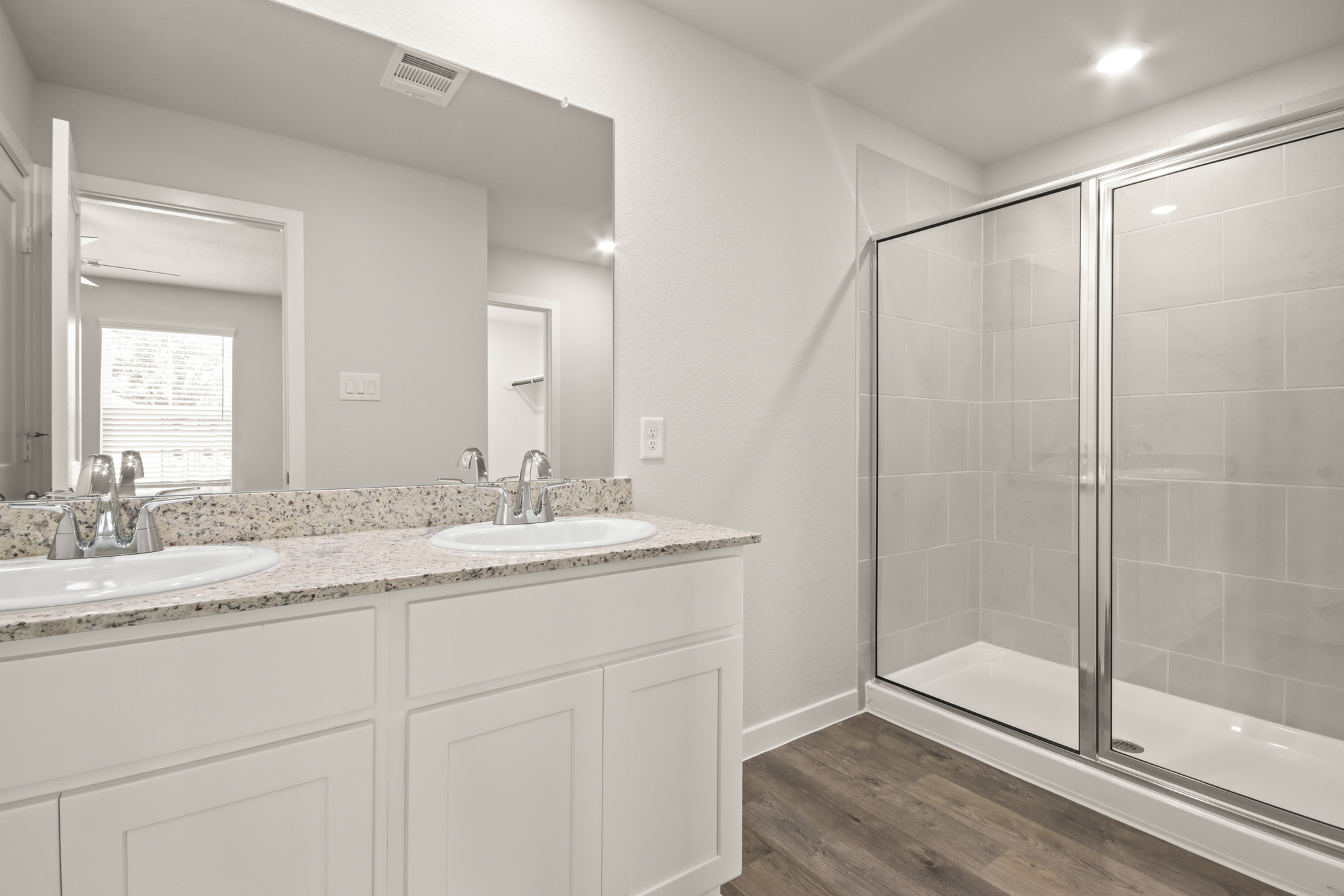 A bathroom with a glass shower.