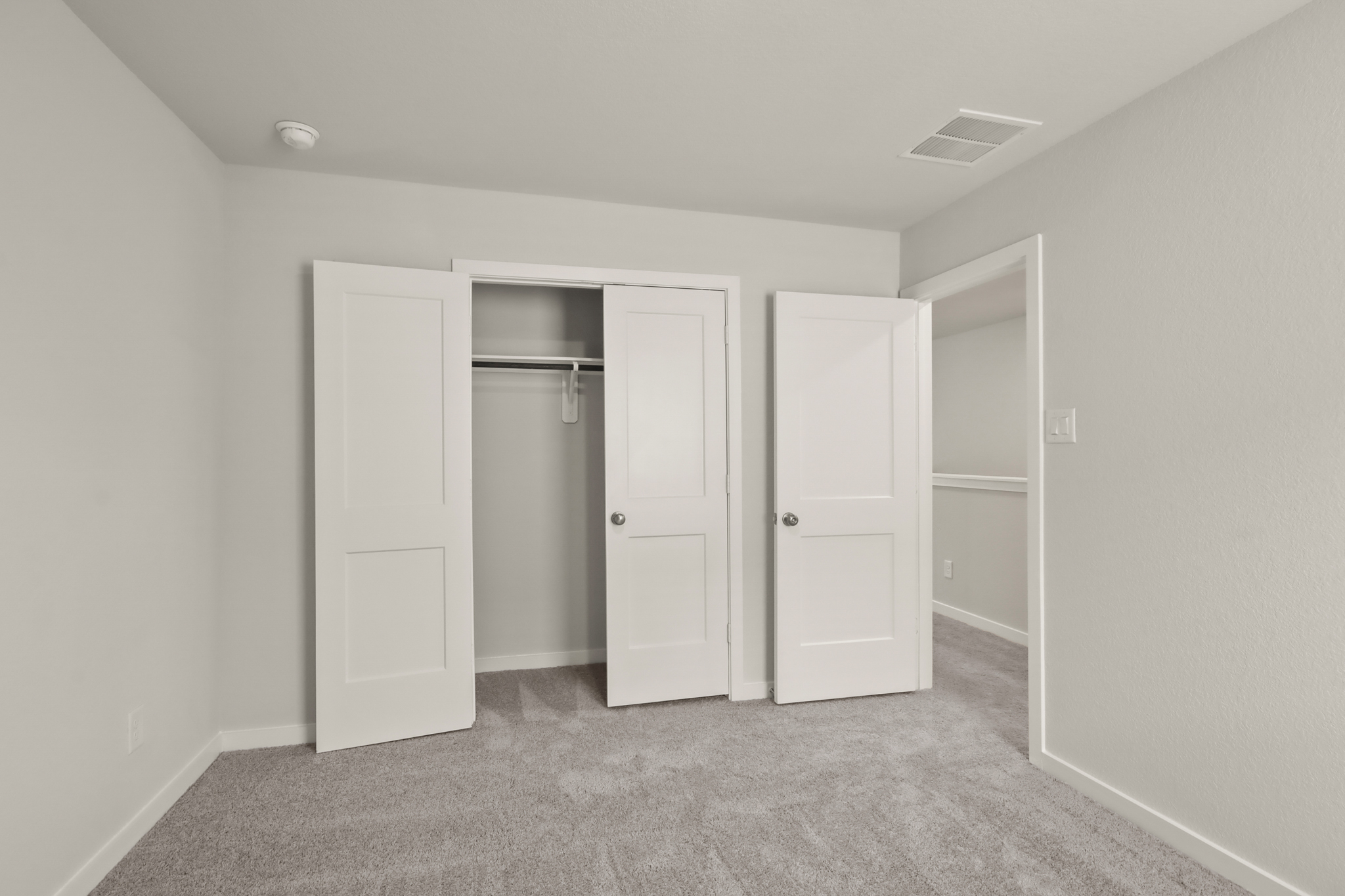 A room with white doors.