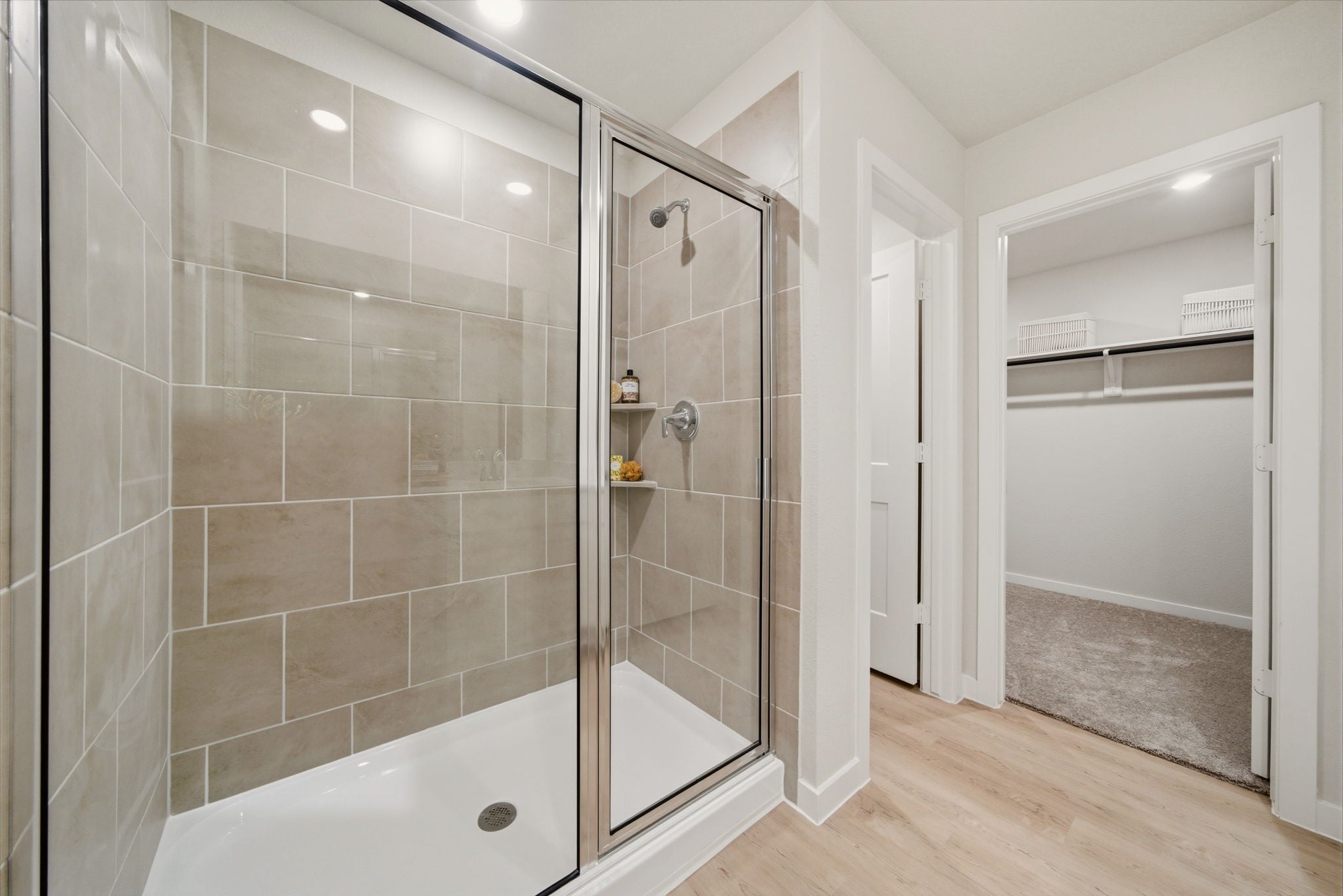 A bathroom with a glass shower.