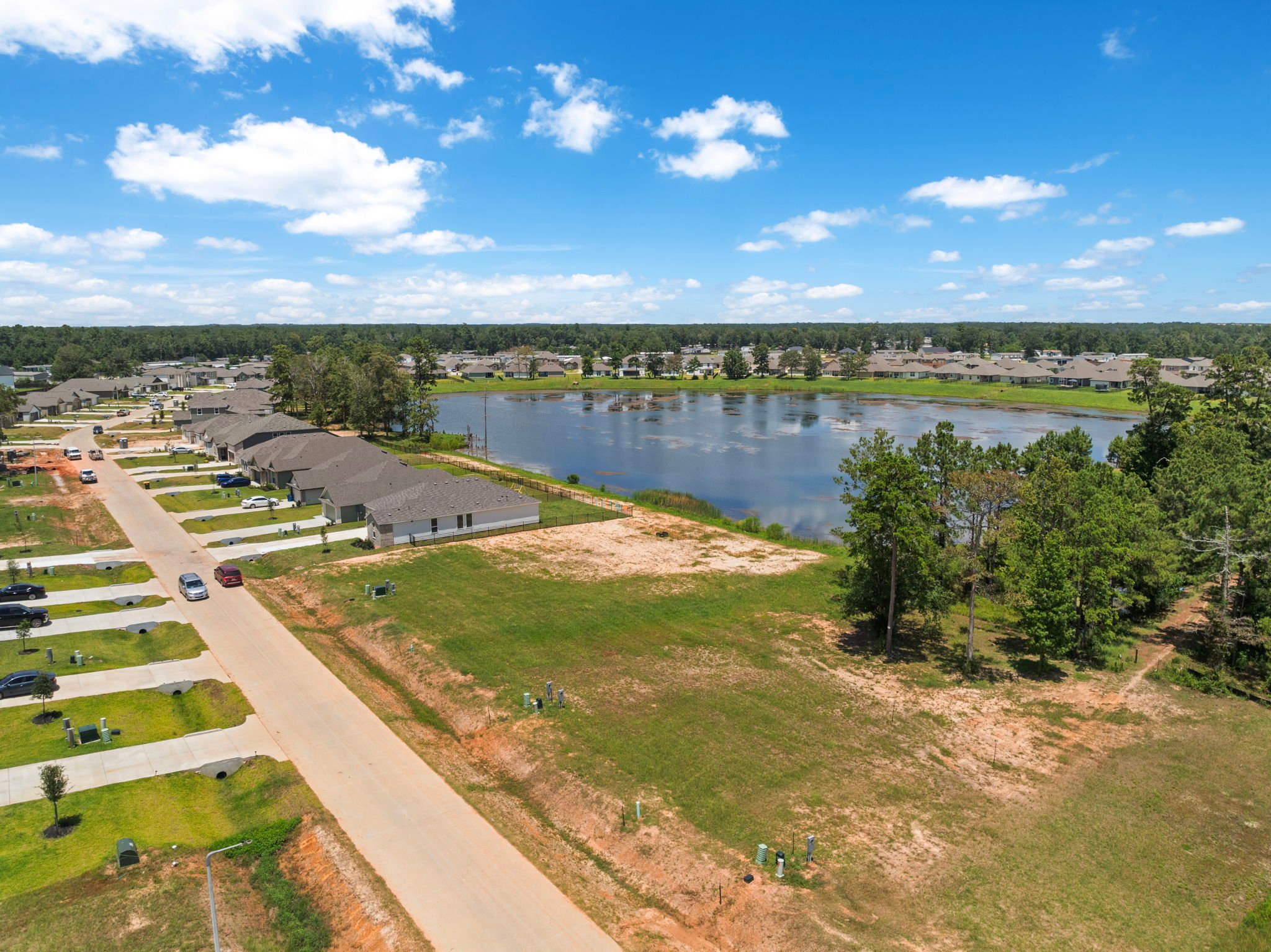A river with a road and trees.
