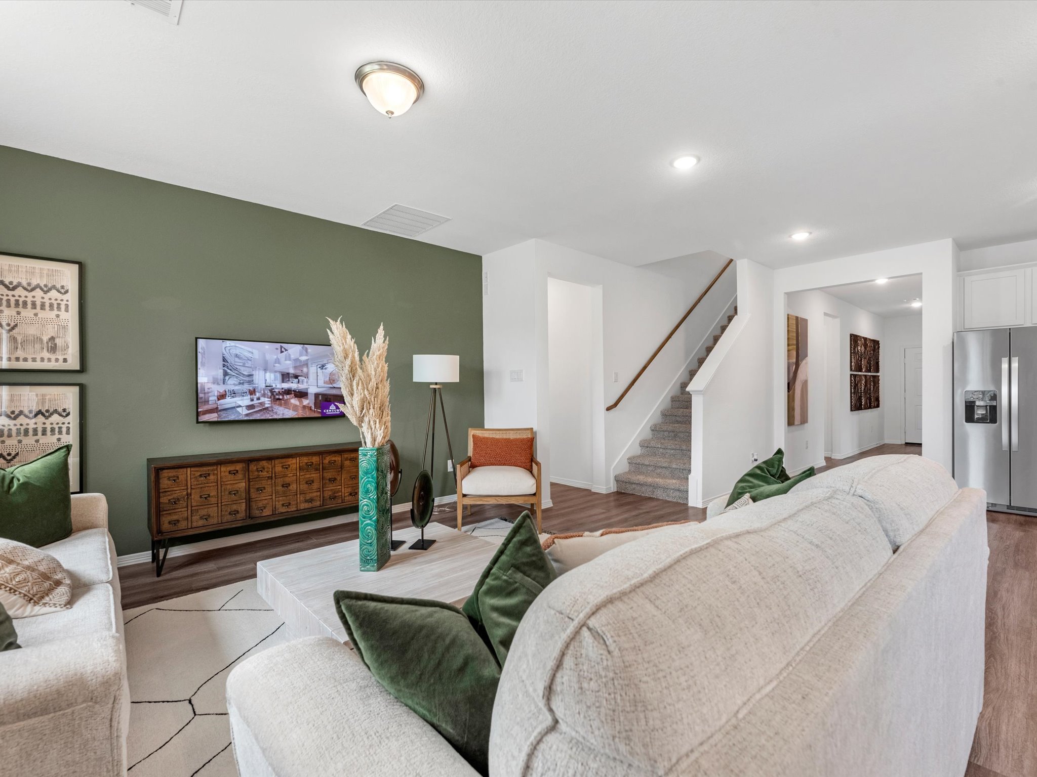 A living room with green walls.